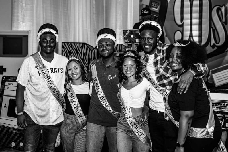 Students wearing crowns at a 90s-themed Homecoming event