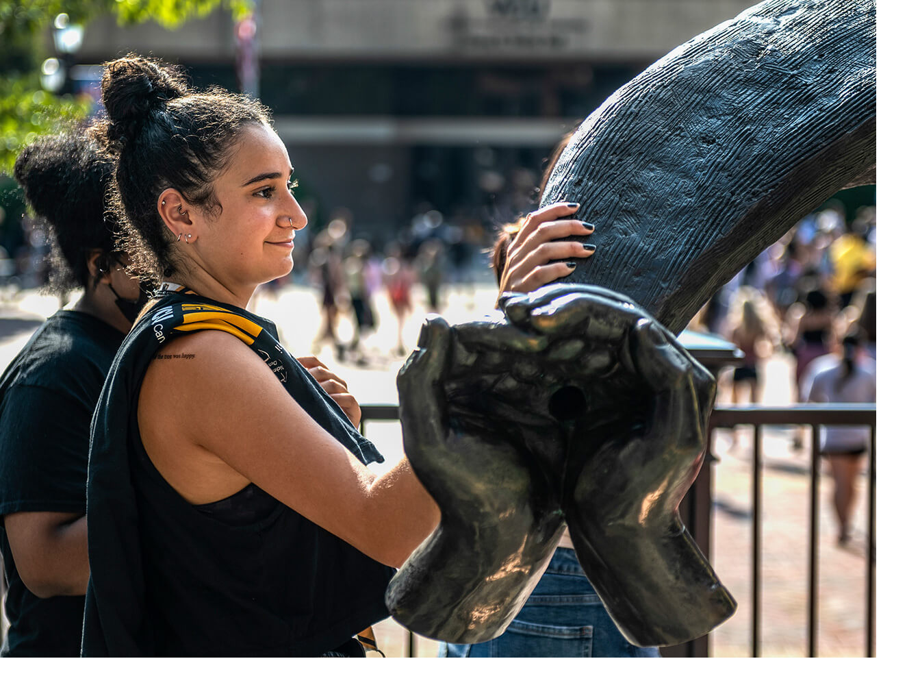 Student Touching Rams Horn