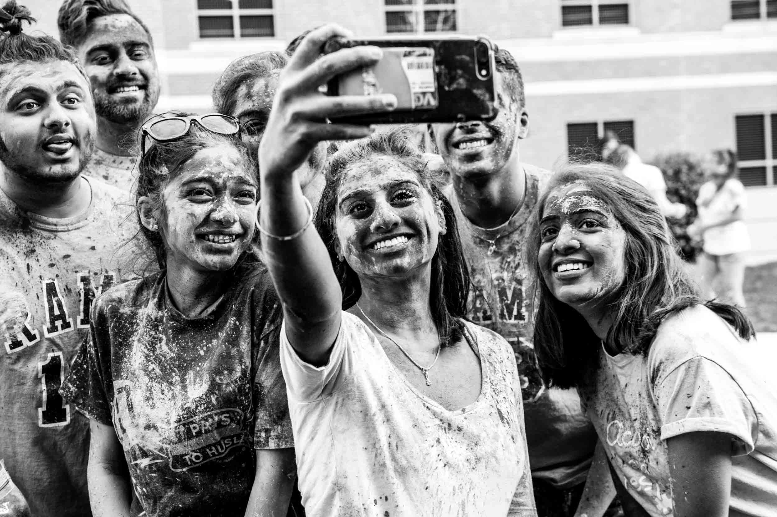Group of students taking a selfie at an event